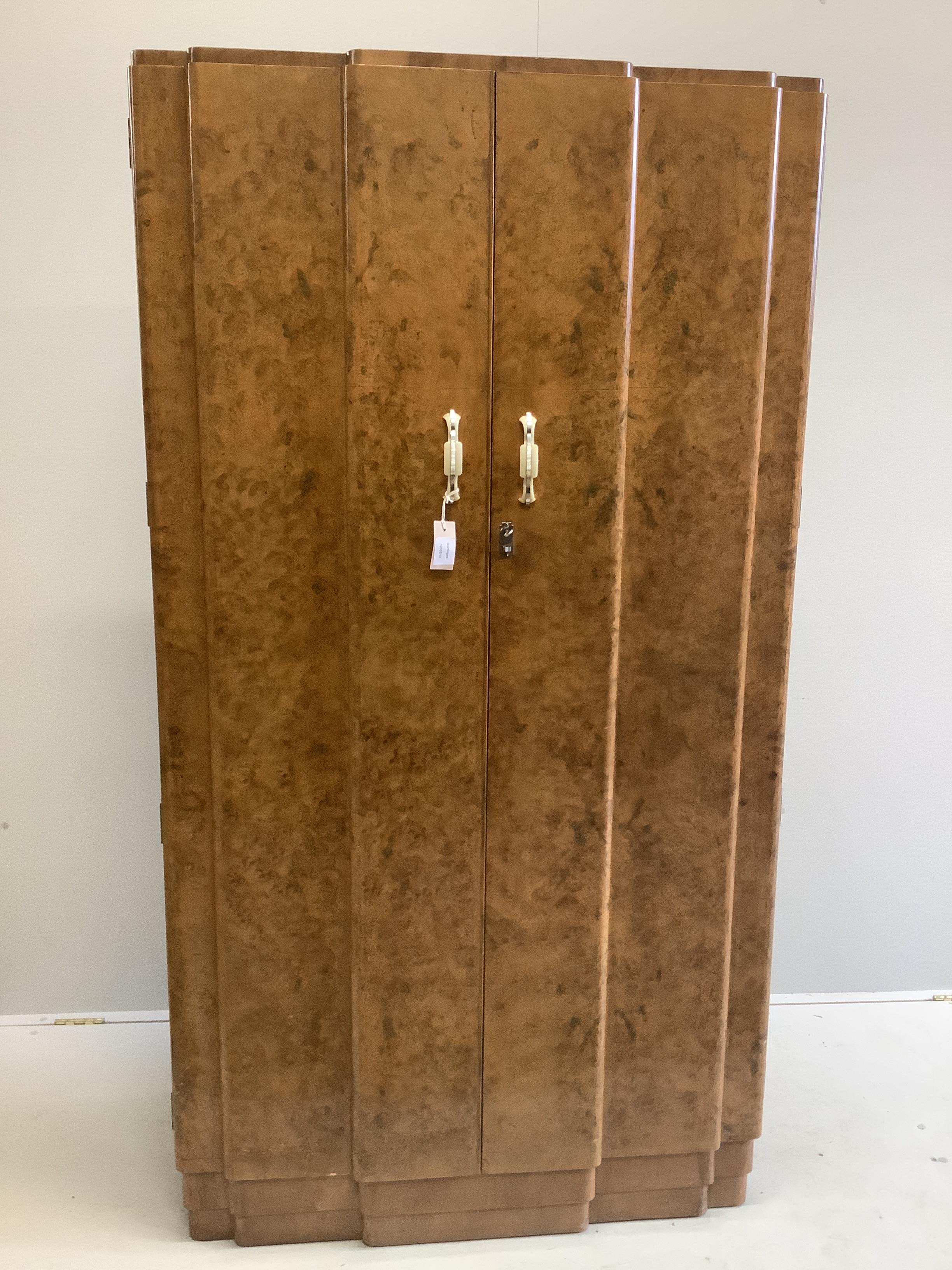 An Art Deco style burr walnut compactum wardrobe, width 96cm, depth 52cm, height 182cm